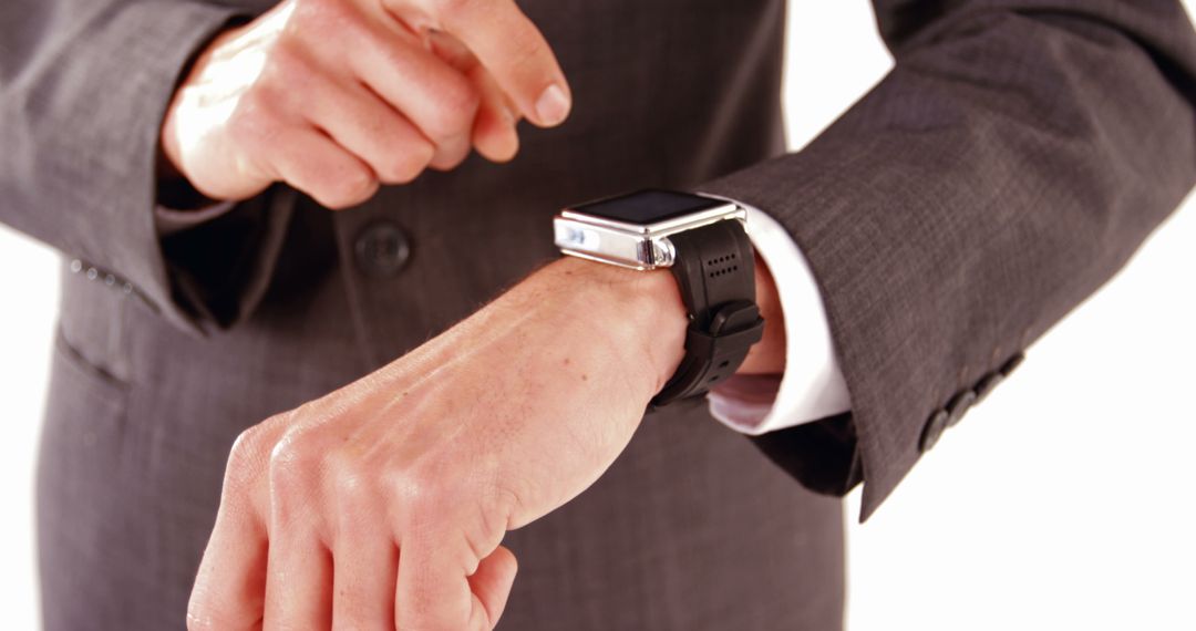 Businessman Using Smartwatch in Professional Setting - Free Images, Stock Photos and Pictures on Pikwizard.com