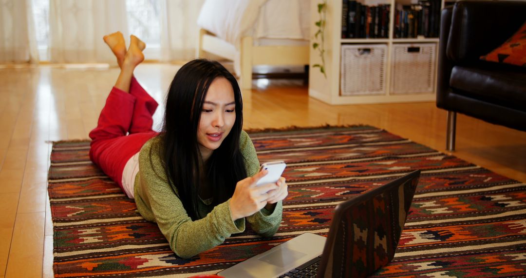 Woman using mobile phone in living room at home - Free Images, Stock Photos and Pictures on Pikwizard.com