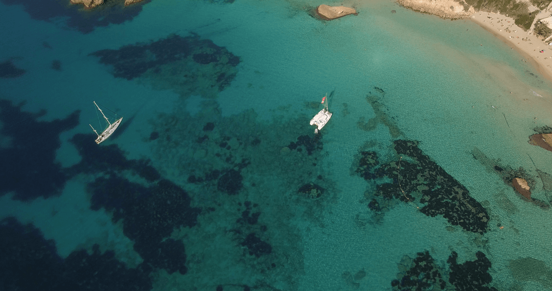 Transparent Waters with Boats in Pristine Tropical Sea