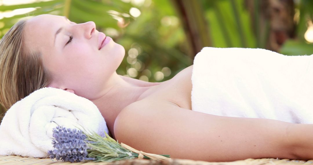 Woman Relaxing During Spa Treatment Outdoors in Tropical Setting - Free Images, Stock Photos and Pictures on Pikwizard.com