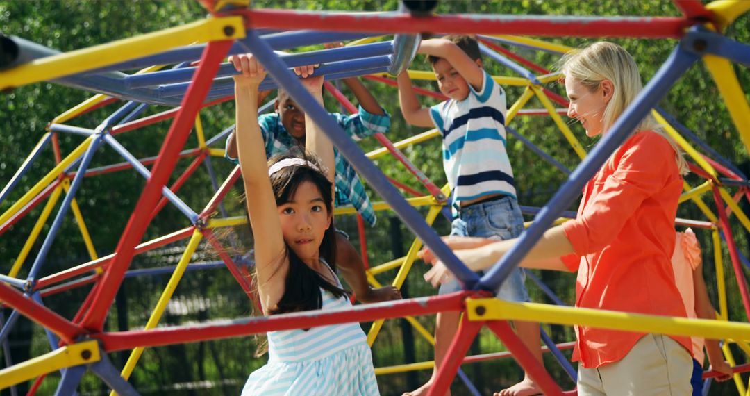 Kids Climbing Jungle Gym with Teacher in Outdoor Playground - Free Images, Stock Photos and Pictures on Pikwizard.com