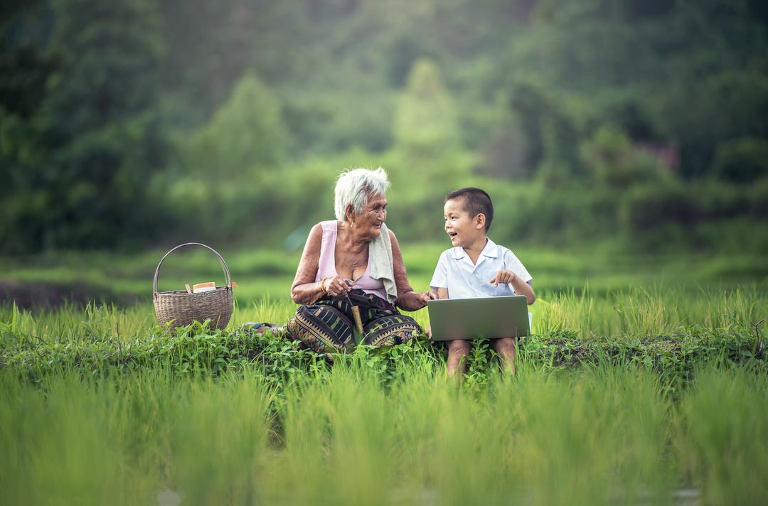 Old Woman Sitting Beside Her Grandson - Free Images, Stock Photos and Pictures on Pikwizard.com