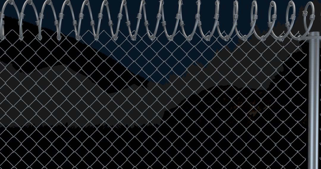Barbed Wire Fence Blocking Mountainous Horizon at Night