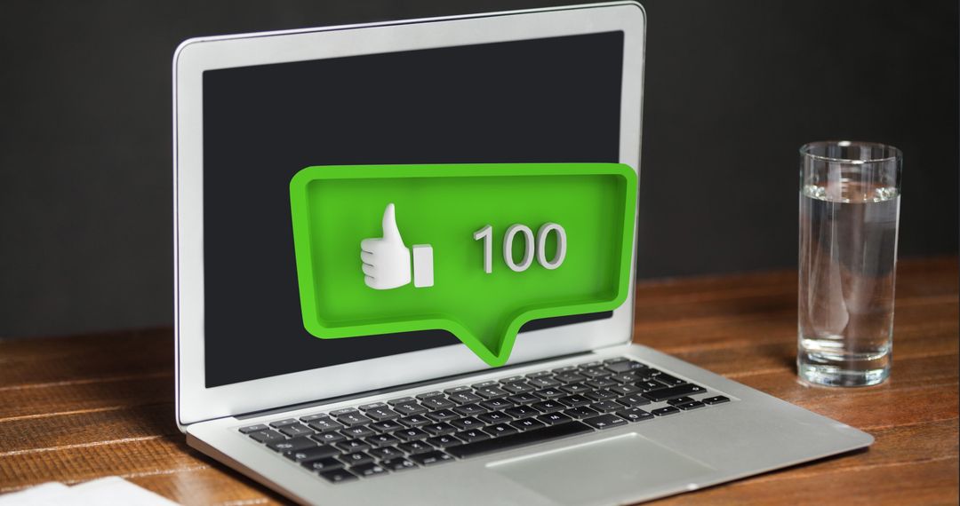 Laptop on Table with Social Media Notification Popup
