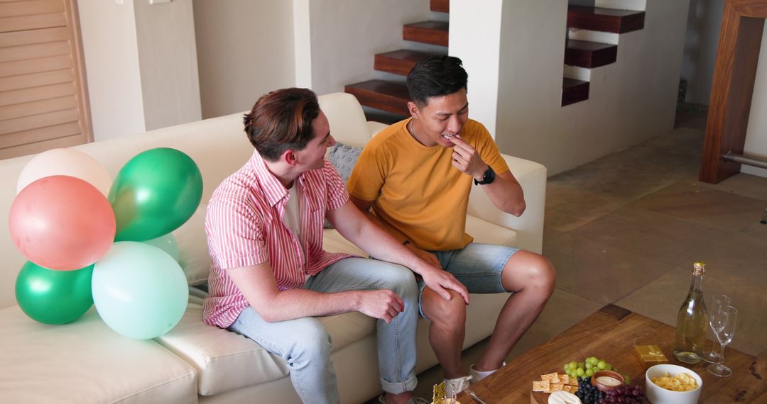 Couple Having Relaxed Conversation in Living Room Lounge