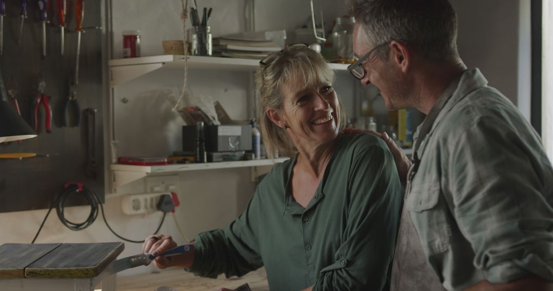 Caucasian Couple Bonding While Upcycling Chair in Home Workshop