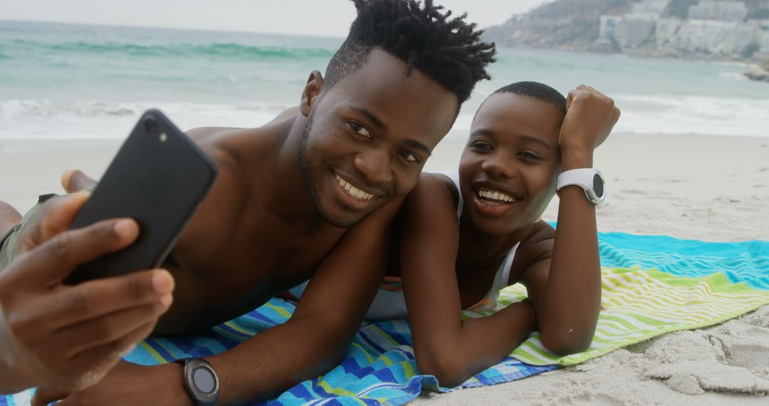Joyful Couple Taking Selfie on a Beach Getaway
