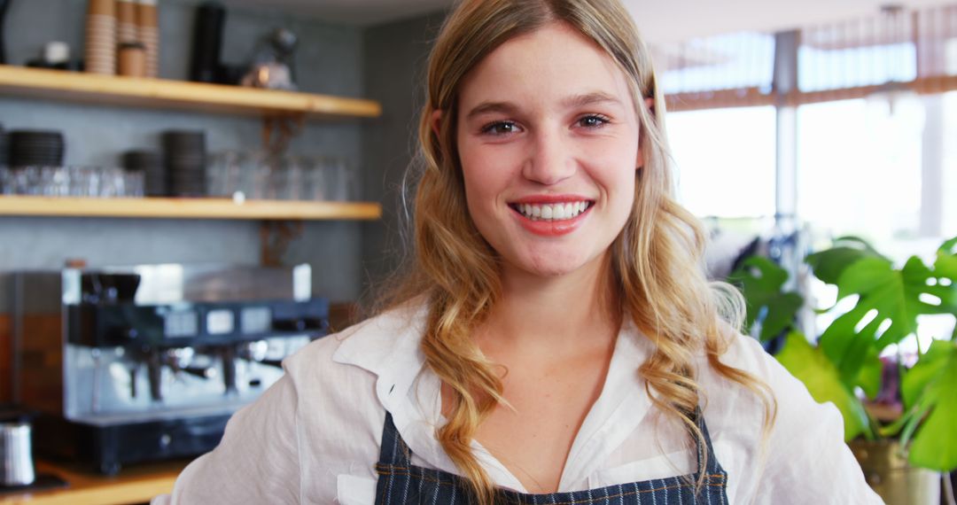 Smiling Female Barista at Coffee Shop - Free Images, Stock Photos and Pictures on Pikwizard.com