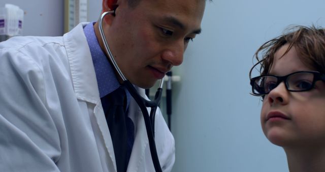 Doctor Examining Child with Stethoscope in Medical Office - Download Free Stock Images Pikwizard.com