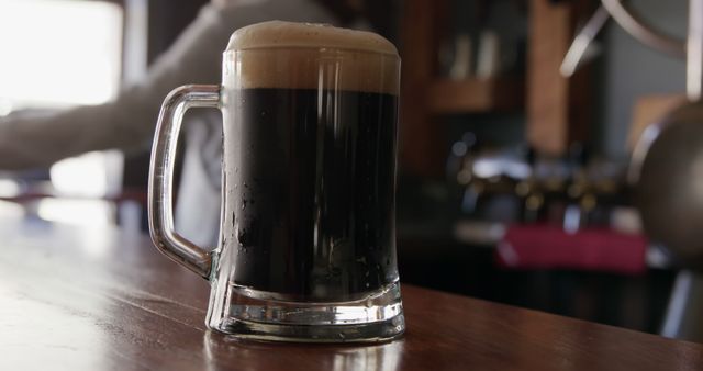 Close-Up of Mug with Dark Beer on Wooden Bar Counter - Download Free Stock Images Pikwizard.com