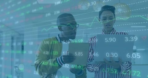 Business Professionals Analyzing Digital Stock Data in Modern Office