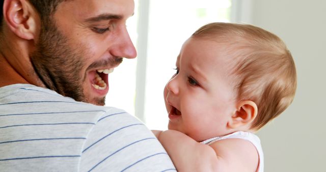 Happy Father Holding His Baby Son - Download Free Stock Images Pikwizard.com