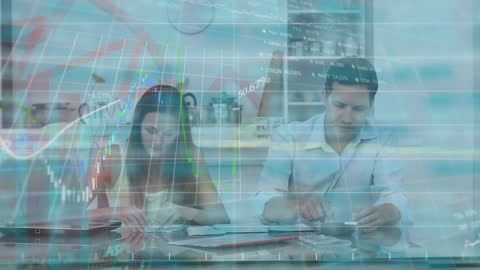 Couple Analyzing Financial Data with Digital Overlay at Home