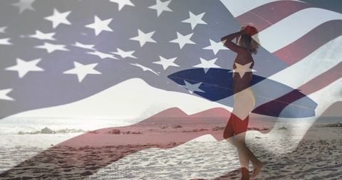 Walking surfer carrying longboard on sunny beach with american flag overlay, summer freedom