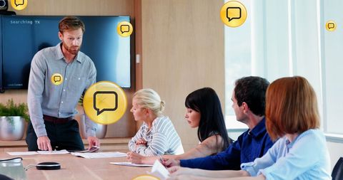 Diverse Business Team Analyzing Social Media Data in Office