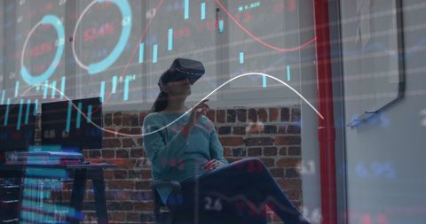 Businesswoman Using VR for Financial Data Analysis in Office