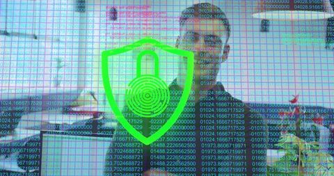 Cybersecurity Shield Overlay on Office Workspace with Code Streams