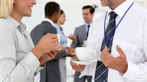 Professionals Networking and Enjoying Coffee at Business Event