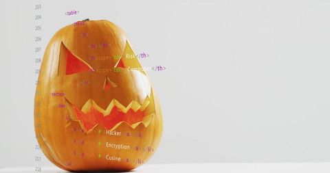 Jack-o'-lantern with code overlay representing hacker encryption and cybersecurity concept