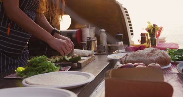 Woman Preparing Food in Food Truck Outdoors - Download Free Stock Images Pikwizard.com