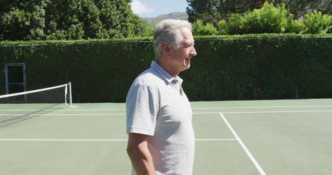 Senior Man Enjoying Tennis Court Leisure