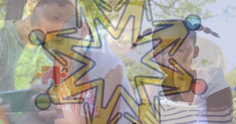 Diverse Group of Children Collaborating Around Tablet in Park