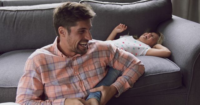 Father and Daughter Bonding and Laughing Together on Sofa - Download Free Stock Images Pikwizard.com