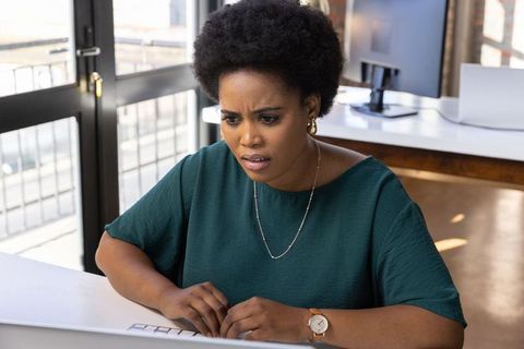 Focused African American Woman Working on Computer in Modern Office