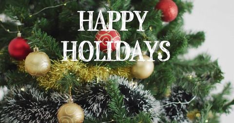 Happy Holidays Text Over Festive Christmas Tree with Gold Tinsel, Red and Gold Baubles