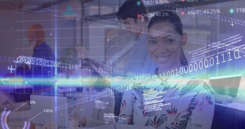 Smiling engineer analyzing stock market data in modern office