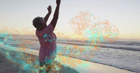 Senior Woman Practicing Wellness on Beach at Sunset