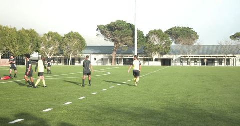 Teen Soccer Players Practicing on Field for Teamwork and Strategy