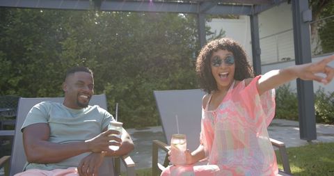 Joyful Couple Enjoying Drinks in Outdoor Patio Setting - Download Free Stock Images Pikwizard.com