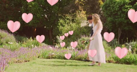 Diverse Couple Strolling in Sunny Garden on Wedding Day - Download Free Stock Images Pikwizard.com