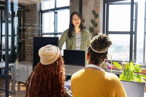 Diverse Female Team Collaborating on Software Development Project