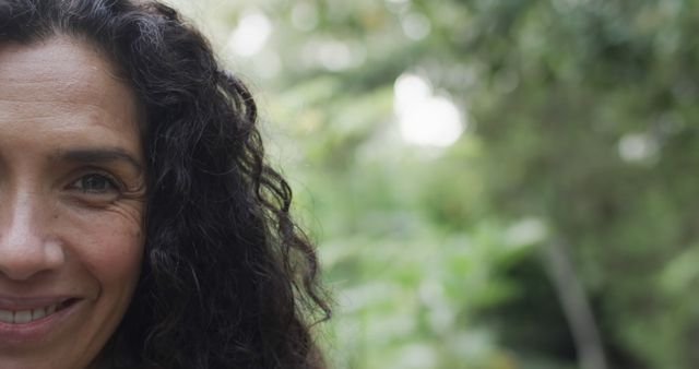 Smiling Woman with Curly Hair in Nature - Download Free Stock Images Pikwizard.com