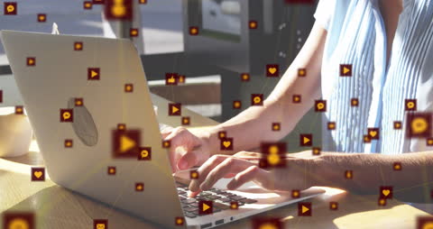 Woman Using Laptop with Digital Data Overlay in Modern Workspace