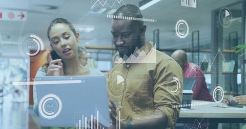 Focused Colleagues Collaborating in Modern Open-Plan Office