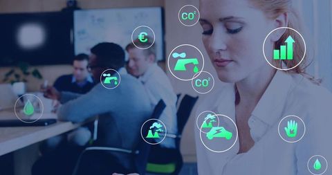 Professional analyzing tablet with sustainability data in modern boardroom