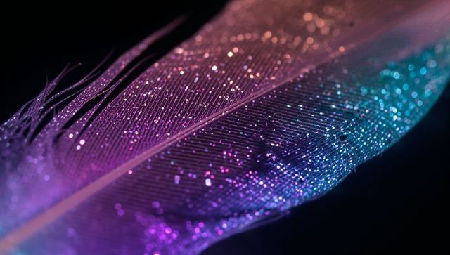 Glowing iridescent feather macro with glittering particles and bokeh gradient