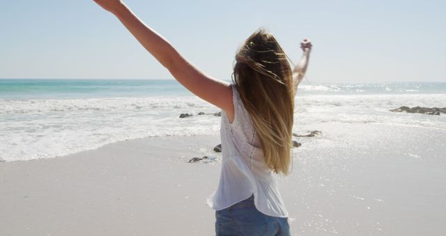 Carefree Woman Enjoying Sunny Beach Day - Download Free Stock Images Pikwizard.com