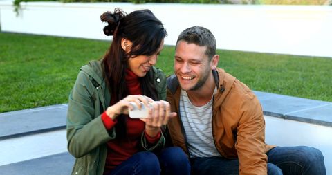 Joyful Couples Sharing Social Media Outdoors - Download Free Stock Images Pikwizard.com