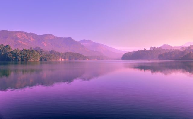 Peaceful Lake Reflecting Pink Mountains at Sunset - Download Free Stock Photos Pikwizard.com