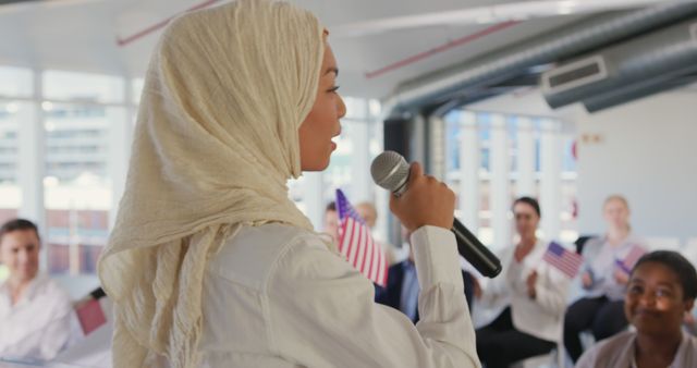 Woman in Hijab Speaking at Political Convention with Engaged Audience - Download Free Stock Images Pikwizard.com