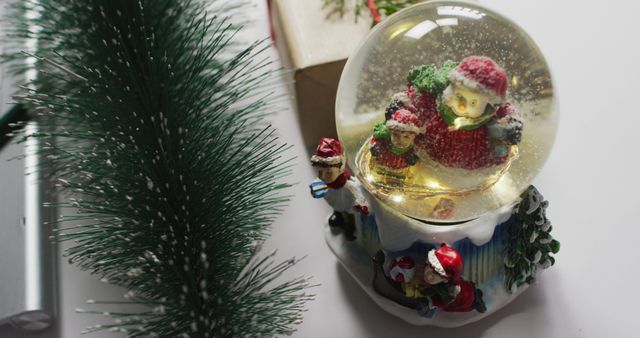 Image of christmas decorations with snow globe on white background - Download Free Stock Photos Pikwizard.com