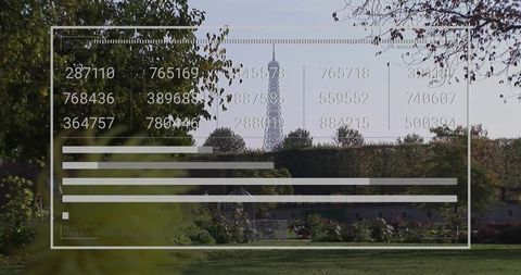 Transparent data overlay with numeric columns and bars over paris park and eiffel tower
