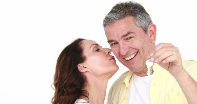 Happy Middle-aged Couple Holding Keys to New Home - Download Free Stock Images Pikwizard.com