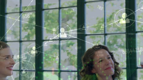 Team Collaborating with Digital Financial Overlays in Office Setting