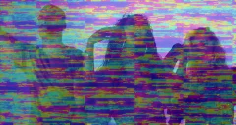 Group Experiencing Neon Glitch in Futuristic Studio Setting