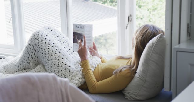 Woman Relaxing with Book by Window at Home - Download Free Stock Images Pikwizard.com